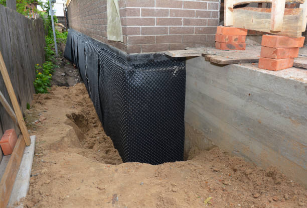 Happy homeowners after waterproofing job in Edison
